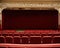 Ai generatedn empty theater with red seats and a red curtain