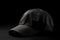 Ai Generative Baseball cap mockup on a black background. Side view. Close-up