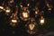 Ai Generative Decorative antique edison style filament light bulbs glowing in the dark