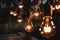 Ai Generative Decorative antique edison style filament light bulbs glowing in the dark