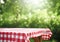 AI generative. Empty picnic table with defocused lush foliage background