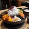 AI generative Patbingsu South Korean dessert made of shaved ice and condensed milk and sweet azuki bean paste topped with fresh