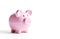 Ai generative. Pink piggy bank on a white