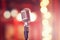 Ai generative. Retro microphone on stage, defocused light bokeh background