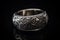 Ai Generative Wedding silver ring with ornament on a black background. Jewelry and luxury concept