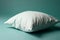 Ai Generative White pillow on a turquoise background, soft focus, close-up