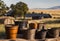 AI illustration of An array of rustic metal buckets lined up in front of a quaint wooden shack.