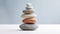 AI illustration of smooth stones carefully stacked atop one another.
