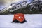 Aice fishing tent set up on a frozen lake in the Canadian Rockies