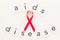 AIDS disease text near red ribbon on white background top view