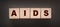 AIDS letters on wooden cubes. STD sexually transmitted diseases