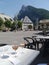 Aiguille de Criou mountain peak from Samoens town in France. Two glasses of rose wine and the town square in the foreground.