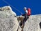 AIGUILLE DU MIDI, FRANCE - AUGUST 8, 2017: Alpinists climbing on rocks at Aiguille du Midi, Chamonix, France