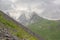 Aiguille the vanoise and Grande Casse mountain peaks in the clouds  in the French Alps