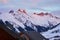 Aiguilles d Arves mountain peaks at sunset, in Les Sybelles ski resort, France, during the Winter holidays