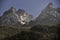 Aiguilles mountain range peaks and green forest. Chamonix, France