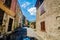 Aiguines, France - June 19, 2018. Cars going through ancient village of Aiguines