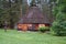 Ail. Altai folk national dwelling with wooden walls and bark-covered roof