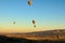 Air balloons festival in Cappadocia. Few hot air balloons against colorful vibrant sky