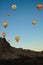 Air balloons festival in Cappadocia. Few hot air balloons against colorful vibrant sky