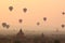 air balloons over Buddhist temples at sunrise. Bagan, Myanmar.