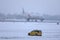 Air China Smiling China livery taxiing in snow, airport police car