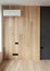 Air condition in modern designed room with natural wooden panels and black electric switch.