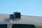 Air conditioner A/C unit on rooftop with a blue sky