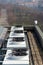 Air conditioning ventilators on roof with houses in background