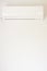Air conditioning. Wall-mounted air conditioner unit against the background of a white wall. Vertical photo. Place for your text
