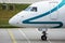 Air Dolomiti Embraer aircraft taxiing in airport, close-up view
