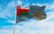 Air Force Ensign of Oman at cloudy sky background on sunset, panoramic view. Oman travel and patriot concept. copy space for wide