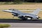 Air force fighter jet plane taking off from an airbase with full speed