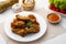 Air Fryer drummet chicken wing with Fish Sauce on white plate