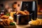 Air fryer with fried breaded chicken on the table in the kitchen. Generative Ai