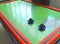 Air hockey table closeup with paddle