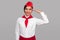 Air hostess saluting and looking at camera