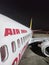 Air India express close up view including windows engine and tails