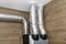 Air intake and exhaust in the home mechanical ventilation with heat recovery with visible insulated pipes with silver foil enterin