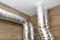 Air intake and exhaust in the home mechanical ventilation with heat recovery with visible insulated pipes with silver foil enterin