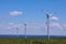 Air mills power station against the blue sky. Alternative energy.