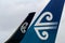 Air New Zealand logo on jet tail and wing.
