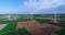 Air panoramas of agricultural fields and wind generators producing electricity. Modern technologies for obtaining