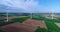 Air panoramas of agricultural fields and wind generators producing electricity. Modern technologies for obtaining