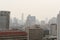 Air pollution effect made low visibility cityscape with haze and fog from dust in the air during sunset in Bangkok, Thailand