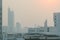 Air pollution effect made low visibility cityscape with haze and fog from dust in the air during sunset in Bangkok, Thailand