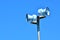 Air raid siren against blue sky