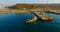 Air review of the coastline of the Russian island with a pier and ships