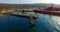 Air review of the coastline of the Russian island with a pier and ships