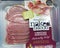 Air sealed packet of bacon on supermarket shelf
